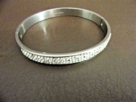 jcm stainless steel rhinestone hinge bangle bracelet in silver tone. . Jcm stainless steel bracelet
